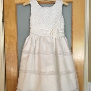 Girl’s long, white, sleeveless dress
